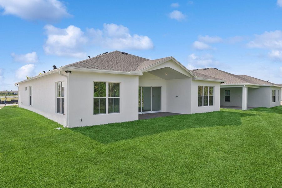 Front exterior of a new home in , Port St. Lucie, FL, highlighting curb appeal (Image 20). Front exterior of a new home in , Port St. Lucie, FL, highlighting curb appeal (Image 20).