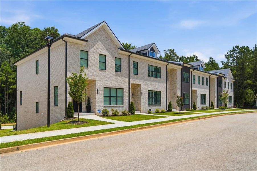Front exterior of a new home in , Stockbridge, GA, highlighting curb appeal (Image 11). Front exterior of a new home in , Stockbridge, GA, highlighting curb appeal (Image 11).