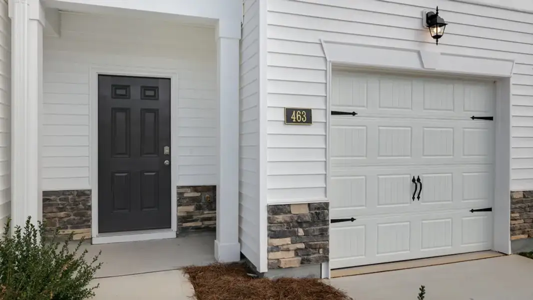 Exterior details and patio area of a home in The Townes at Galvins Ridge, Sanford (Image 3).