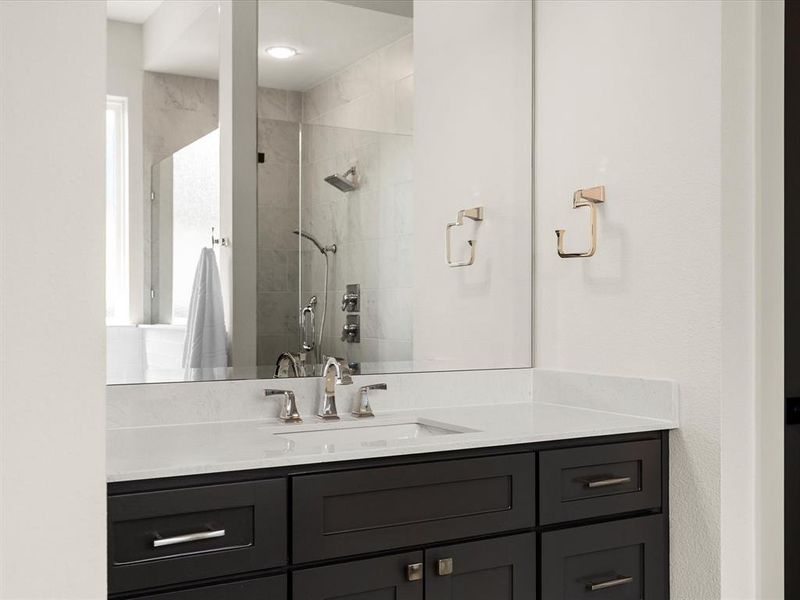 Full bathroom with vanity and tiled shower Full bathroom with vanity and tiled shower