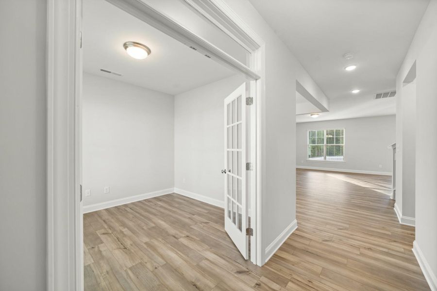 Spacious, unfurnished interior of a new home in Cottages at Piper Village, Trinity (Image 16).