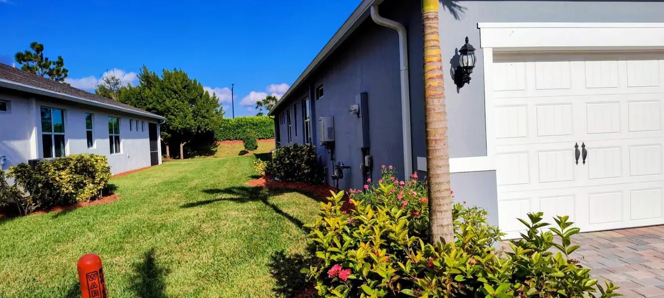 Exterior details and patio area of a home in Del Webb Tradition, Port St. Lucie (Image 3).
