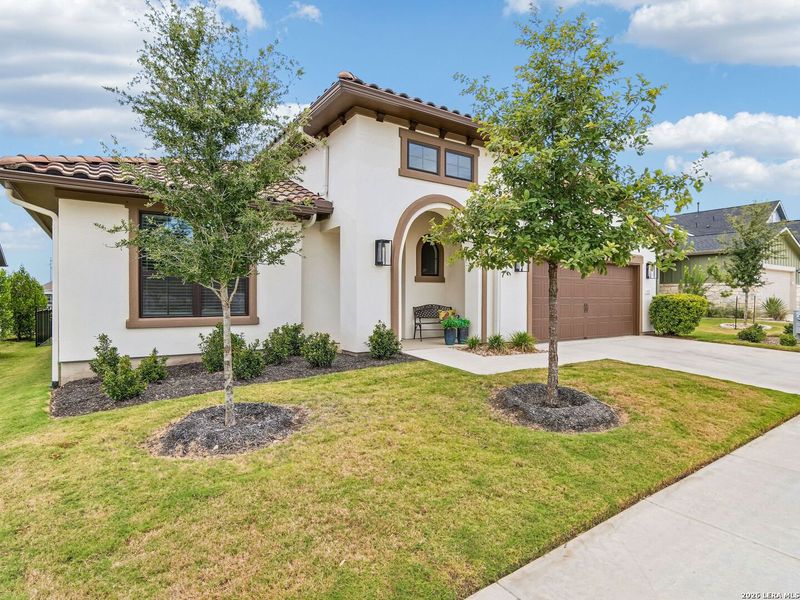 Front exterior of a new home in Kissing Tree, San Marcos, TX, highlighting curb appeal (Image 21). Front exterior of a new home in Kissing Tree, San Marcos, TX, highlighting curb appeal (Image 21).