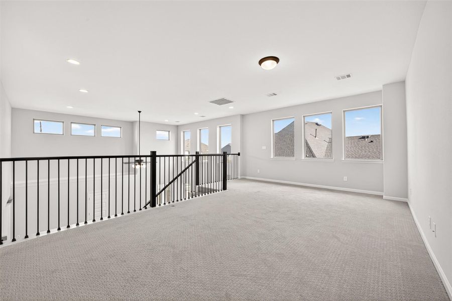 Spacious, unfurnished interior of a new home in Cane Island, Katy (Image 30).