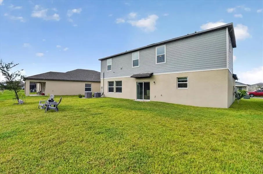 Exterior details and patio area of a home in Prosperity Lakes, Parrish (Image 3).