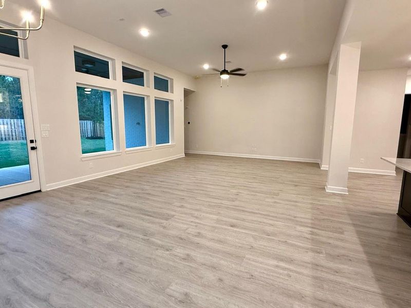 BIG Living area with 12 ft ceilings, vinyl plank floors and big windows to bring the outside in! BIG Living area with 12 ft ceilings, vinyl plank floors and big windows to bring the outside in!