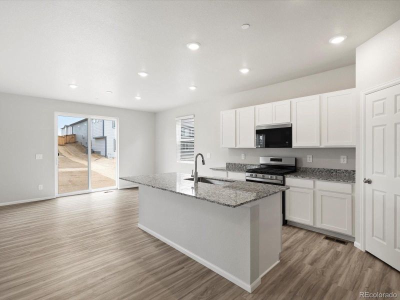 Furnished interior view inside a new home in Buffalo Highlands: The Flora Collection, Commerce City (Image 6).