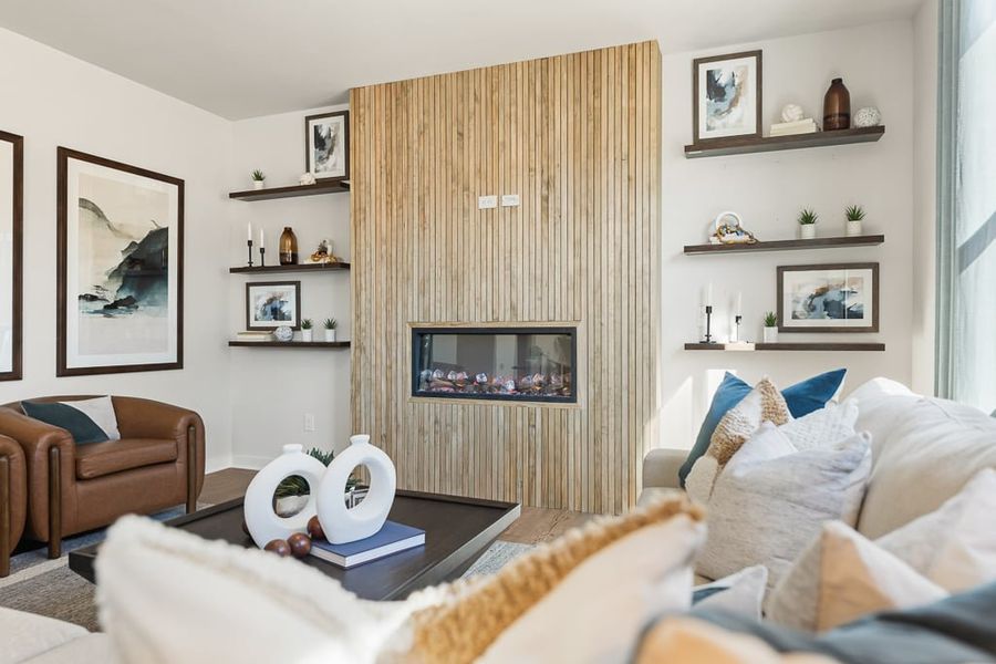 A living room with a couch and a table.