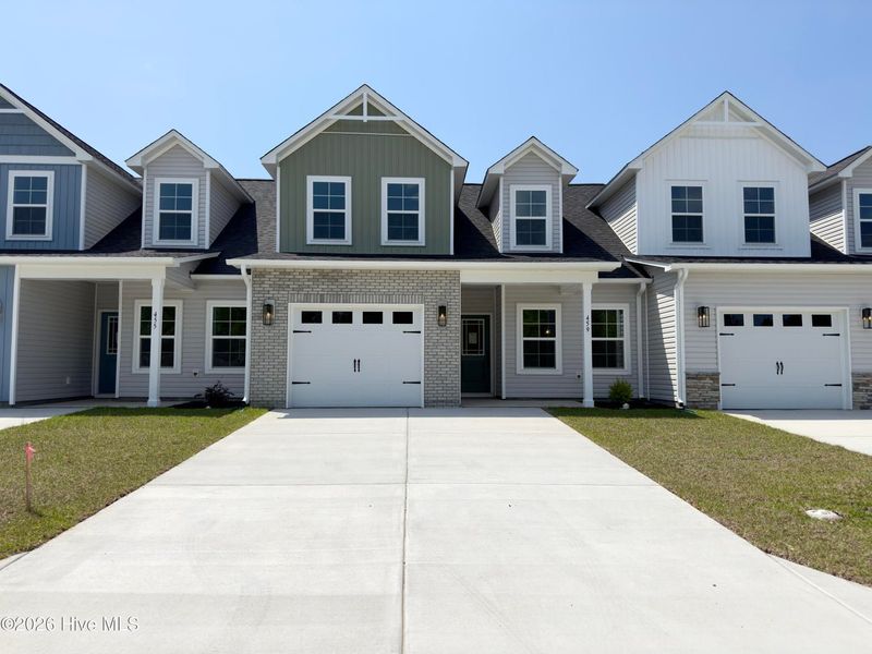 Front exterior of a new home in Autumn Trail, Bolivia, NC, highlighting curb appeal (Image 2). Front exterior of a new home in Autumn Trail, Bolivia, NC, highlighting curb appeal (Image 2).