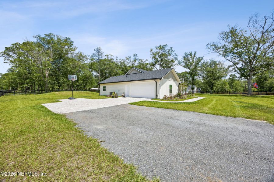 Front exterior of a new home in , Macclenny, FL, highlighting curb appeal (Image 2). Front exterior of a new home in , Macclenny, FL, highlighting curb appeal (Image 2).