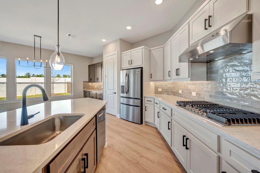 Furnished interior view inside a new home in COLTON - Reserve Collection, Todd Mission (Image 11).