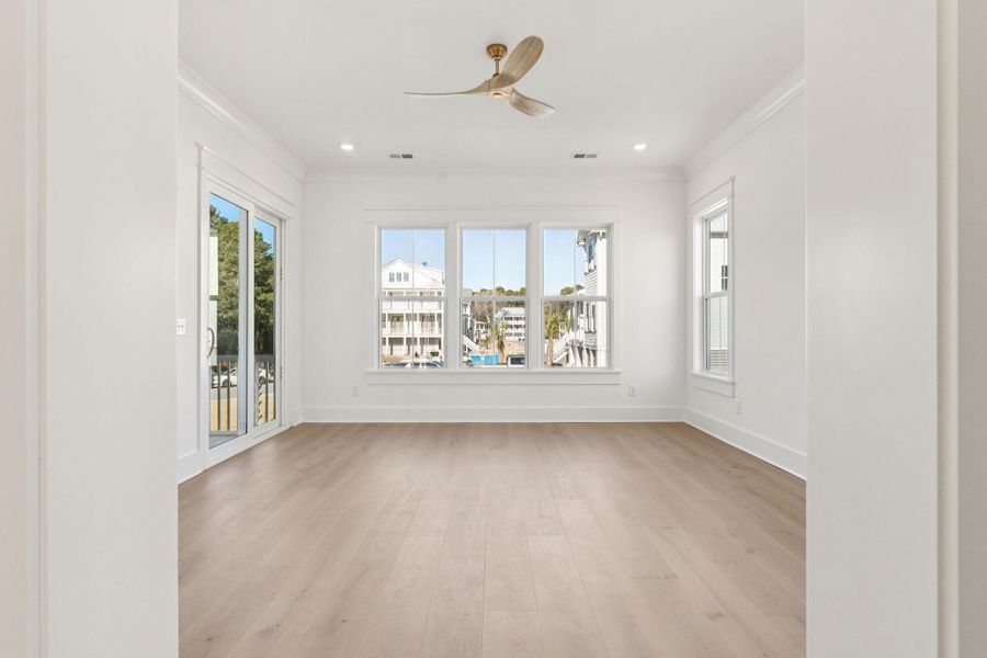 Spacious, unfurnished interior of a new home in Overlook at Copahee Sound, Awendaw (Image 62).