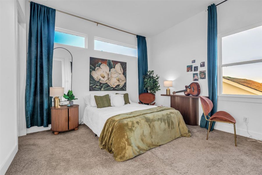 Guest Suite:A serene retreat framed by tall windows and rich drapery, this guest suite offers warmth, comfort, and style, inviting moments of rest and quiet luxury.