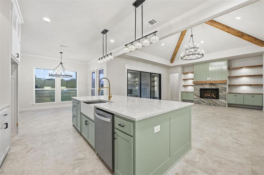 Kitchen featuring green cabinetry, a chandelier, a premium fireplace, white cabinetry, and recessed lighting Kitchen featuring green cabinetry, a chandelier, a premium fireplace, white cabinetry, and recessed lighting