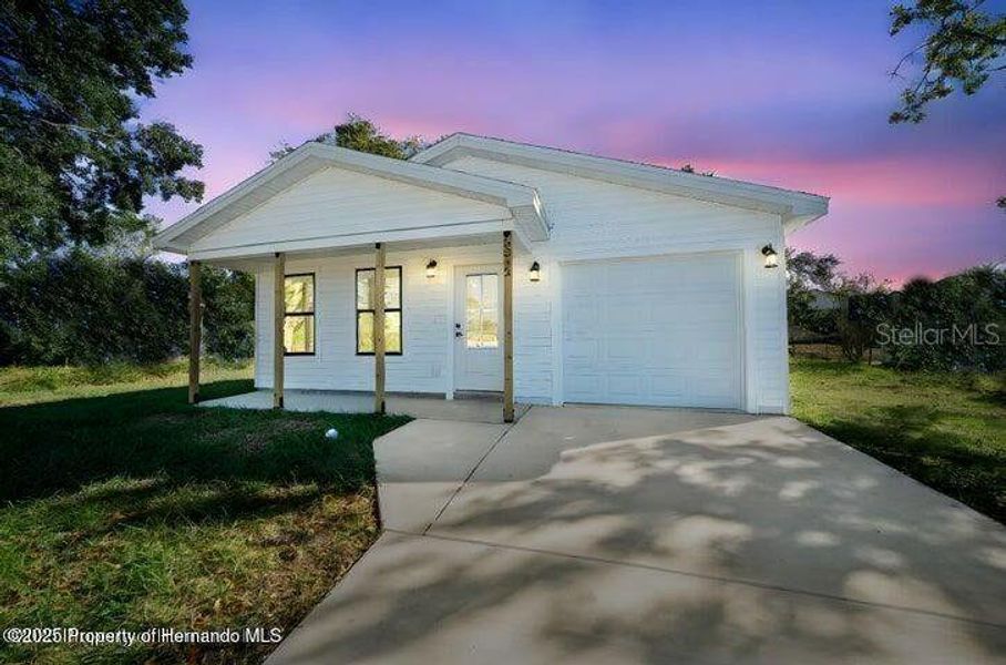 Front exterior of a new home in , Weeki Wachee, FL, highlighting curb appeal (Image 19). Front exterior of a new home in , Weeki Wachee, FL, highlighting curb appeal (Image 19).