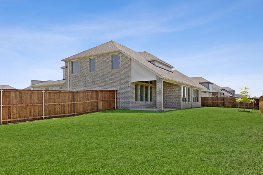 Covered Patio in the Henley home plan by Trophy Signature Homes – REPRESENTATIVE PHOTO