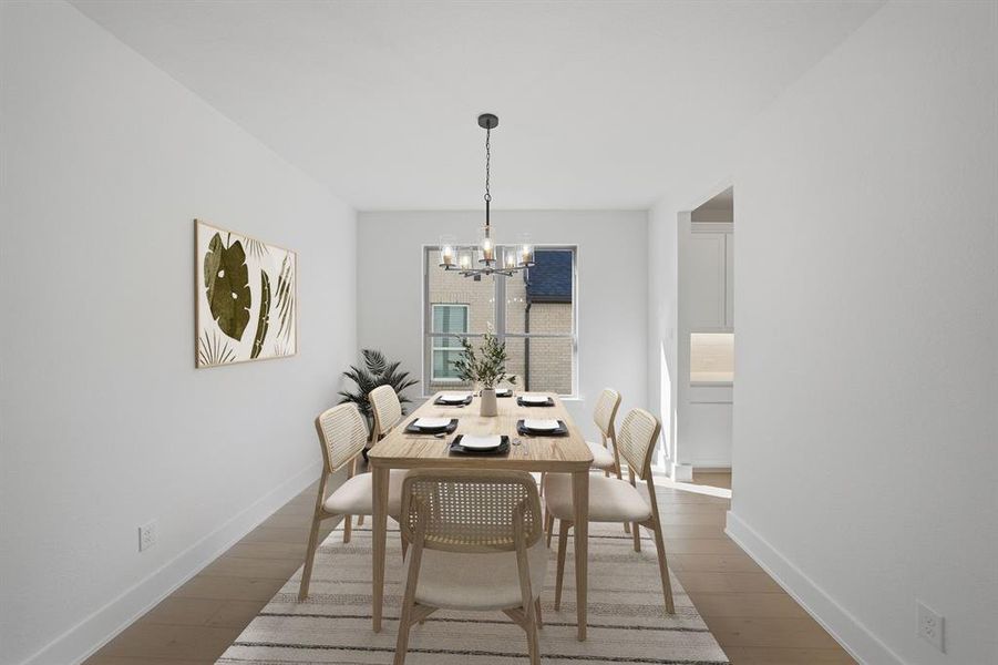 Dining space featuring a chandelier and hardwood / wood-style flooring Dining space featuring a chandelier and hardwood / wood-style flooring
