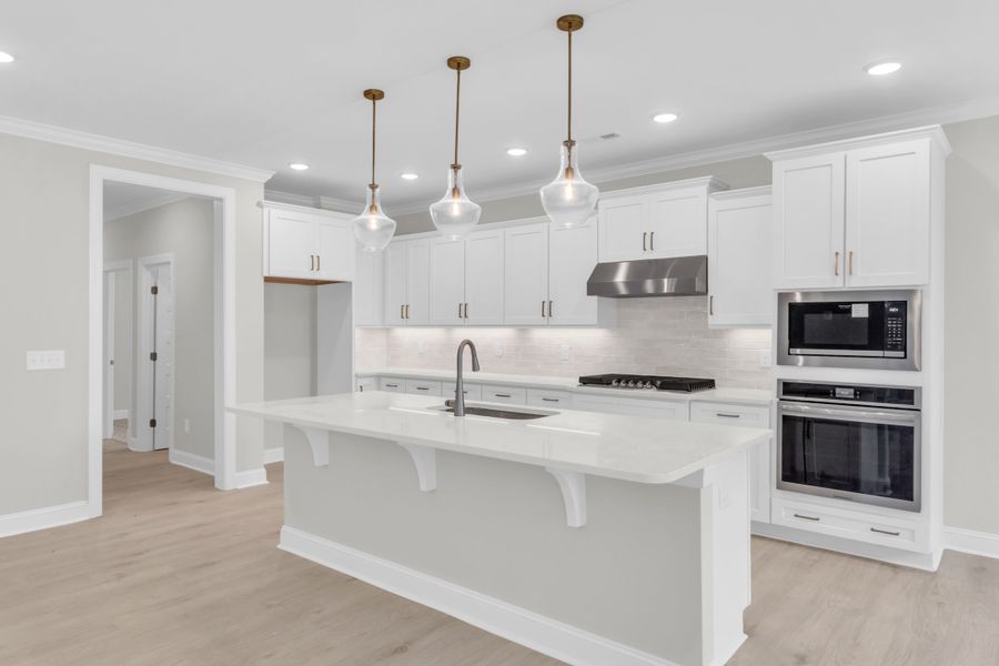 Representative furnished interior of a home built from the The Bradley by RobuckHomes in Windwater, Hampstead (Image 60).