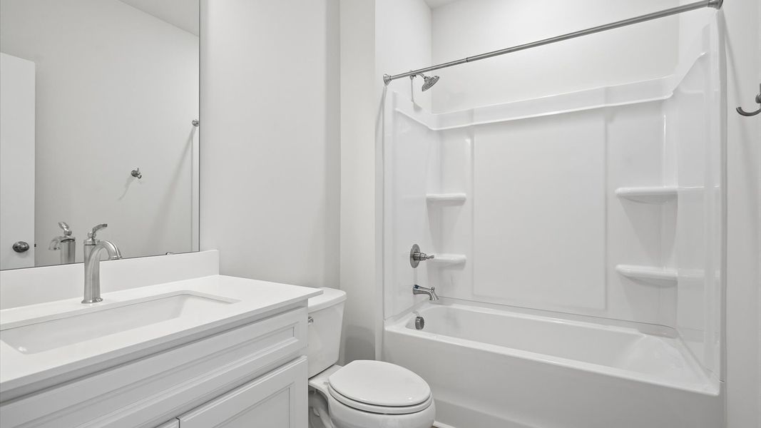 Accomplished full bath designed with both comfort and sophistication in mind at the Iris Meadows community Accomplished full bath designed with both comfort and sophistication in mind at the Iris Meadows community