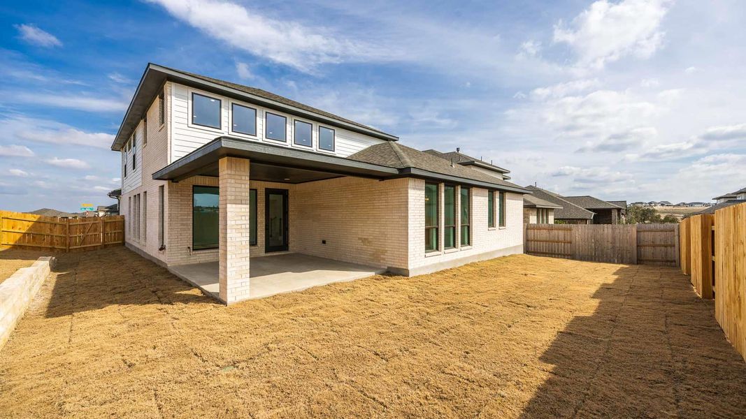 Exterior details and patio area of a home in Lariat 60', Liberty Hill (Image 3).