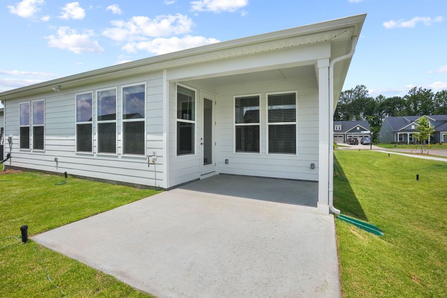 Exterior details and patio area of a home in Carolina Riverside, Belmont (Image 40).