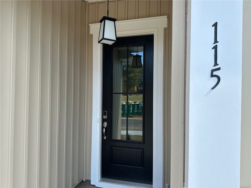 The inviting entryway features a classic black doo
