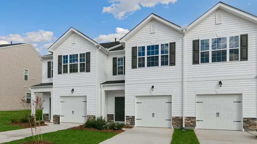 Front exterior of a new home in The Townes at Galvins Ridge, Sanford, NC, highlighting curb appeal (Image 17).