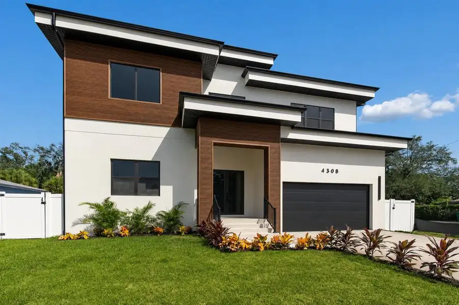 Front exterior of a new home in , Tampa, FL, highlighting curb appeal (Image 2). Front exterior of a new home in , Tampa, FL, highlighting curb appeal (Image 2).