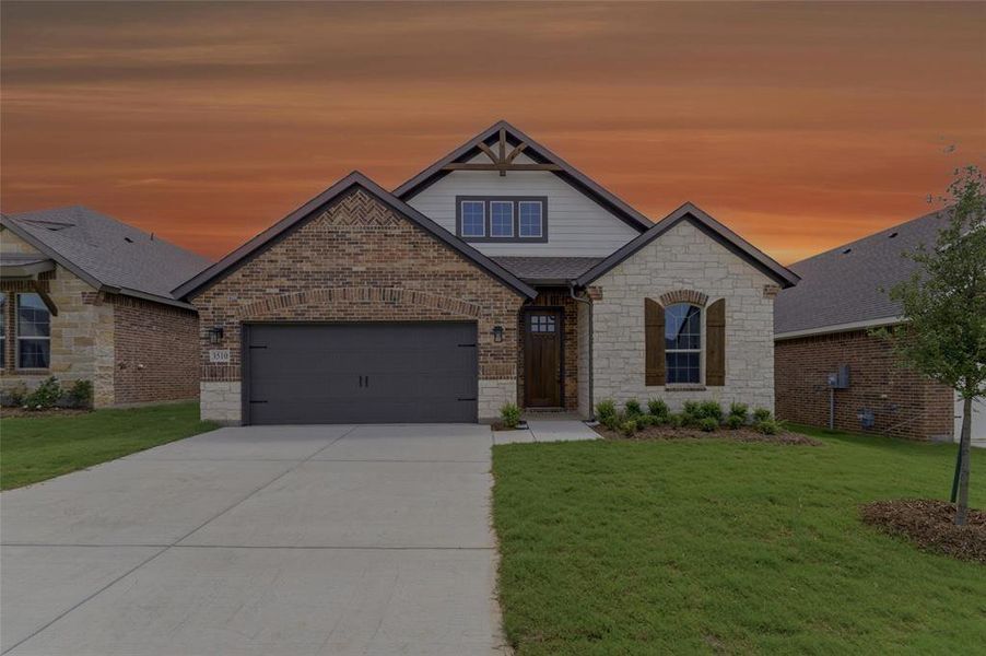 Stone and brick facade featuring a wood-panel garage door, arched entry, and dark-framed windows with decorative shutters Stone and brick facade featuring a wood-panel garage door, arched entry, and dark-framed windows with decorative shutters
