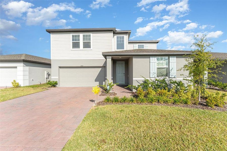 Front exterior of a new home in Villamar - Signature Series, Winter Haven, FL, highlighting curb appeal (Image 1).