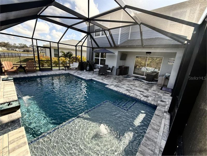 Exterior details and patio area of a home in Isles at BayView, Parrish (Image 22).