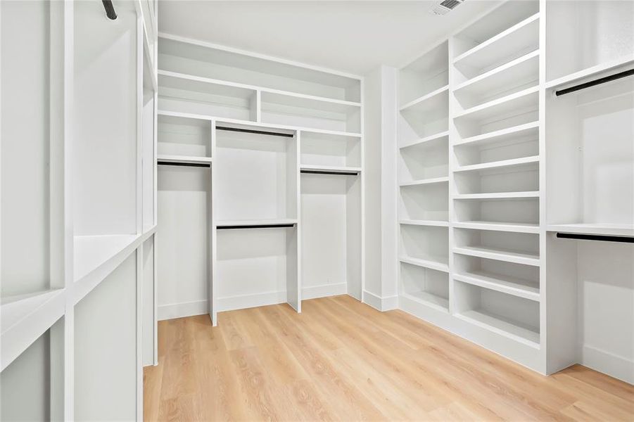 Walk in closet featuring light wood-type flooring