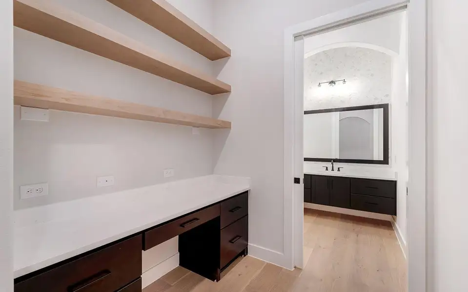 Desk area leading to powder room.