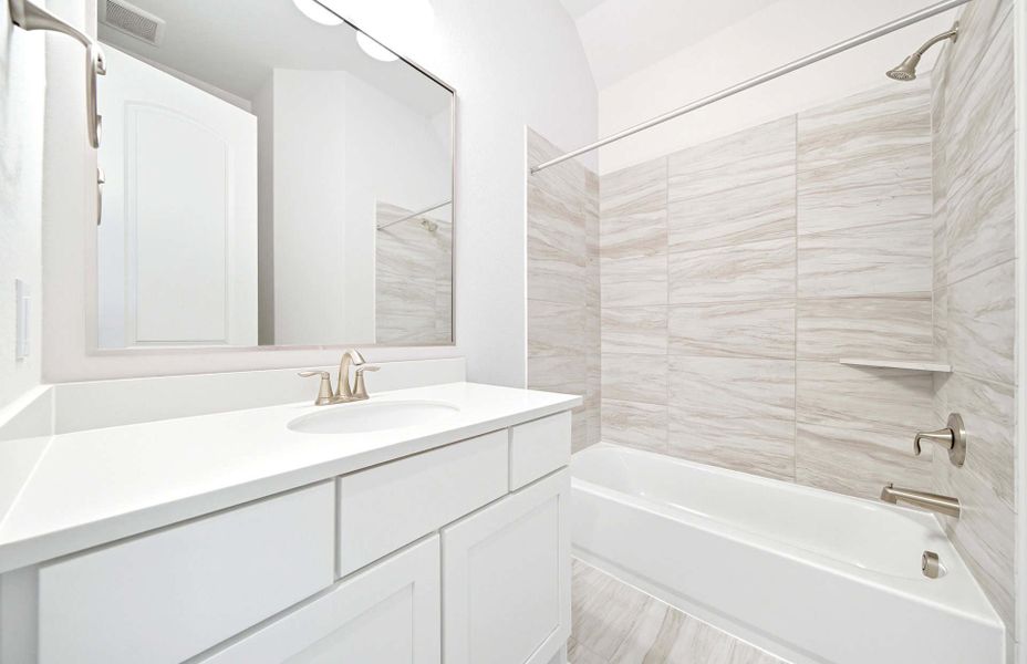 Representative furnished interior of a home built from the 3663 by Ravenna Homes in Artavia 70′, Conroe (Image 19).