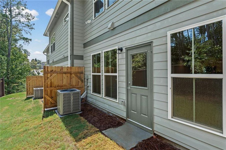 Exterior details and patio area of a home in Ansley Towns, Cumming (Image 3).