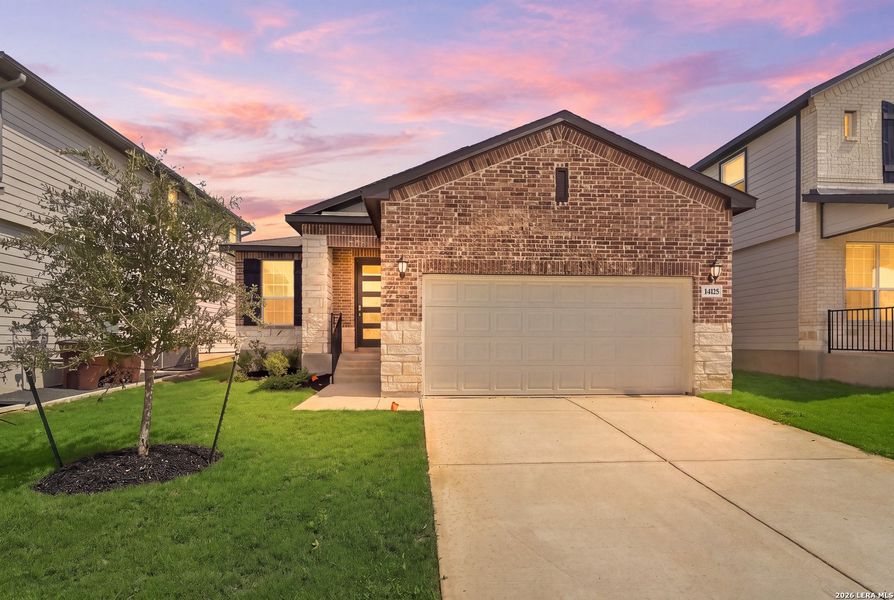 Front exterior of a new home in Thomas Pond, San Antonio, TX, highlighting curb appeal (Image 24).