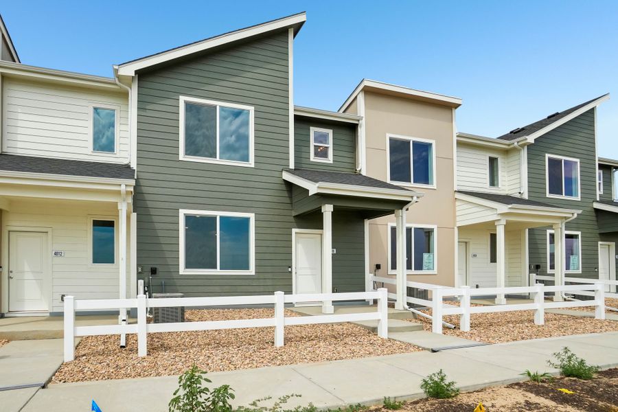 Front exterior of a new home in Liberty Draw, Evans, CO, highlighting curb appeal (Image 20).