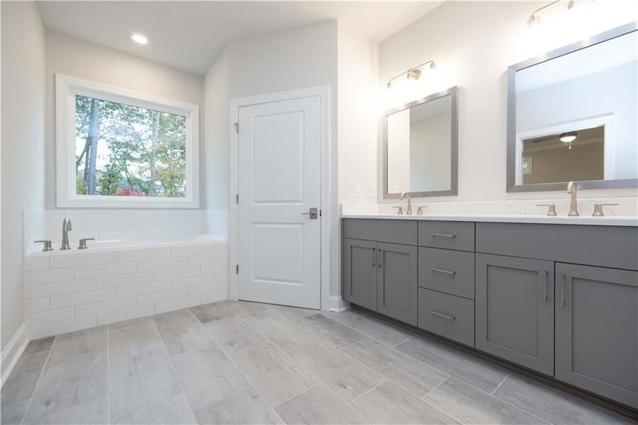 Soaking tub...*Please note photos shown are of the Ellington plan but not of the actual home.