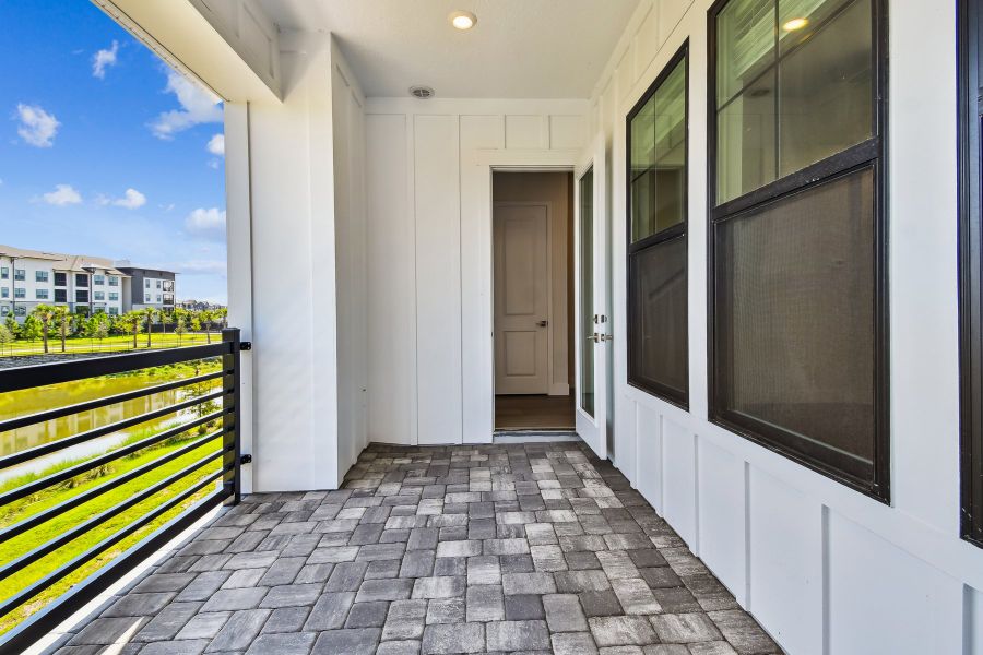 Exterior details and patio area of a home in Emerald Landing at Waterside at Lakewood Ranch – City Homes, Sarasota (Image 2).