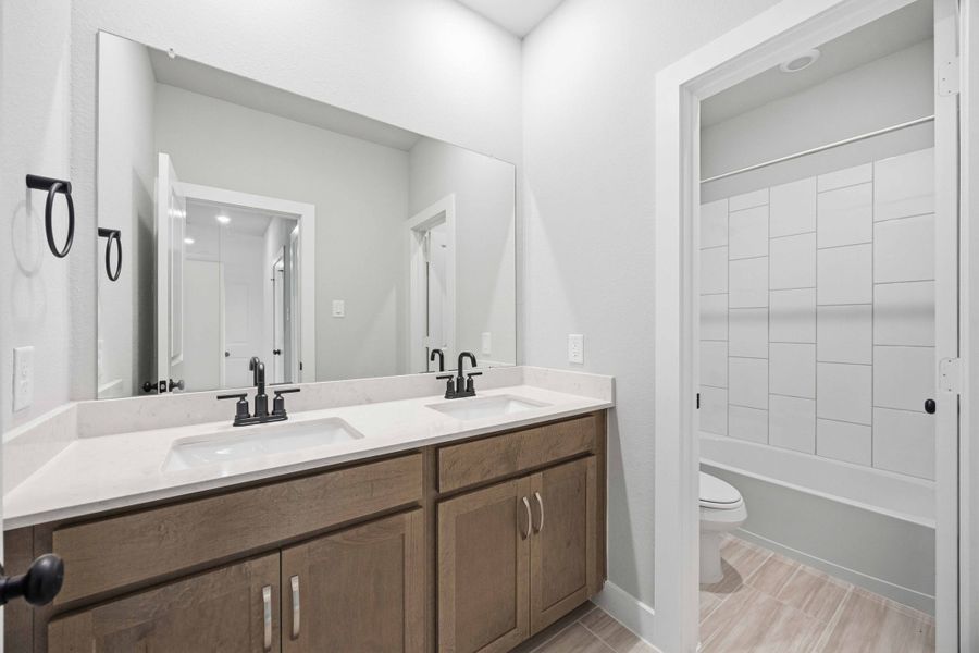 Furnished interior view inside a new home in Sunterra 50s, Katy (Image 17).