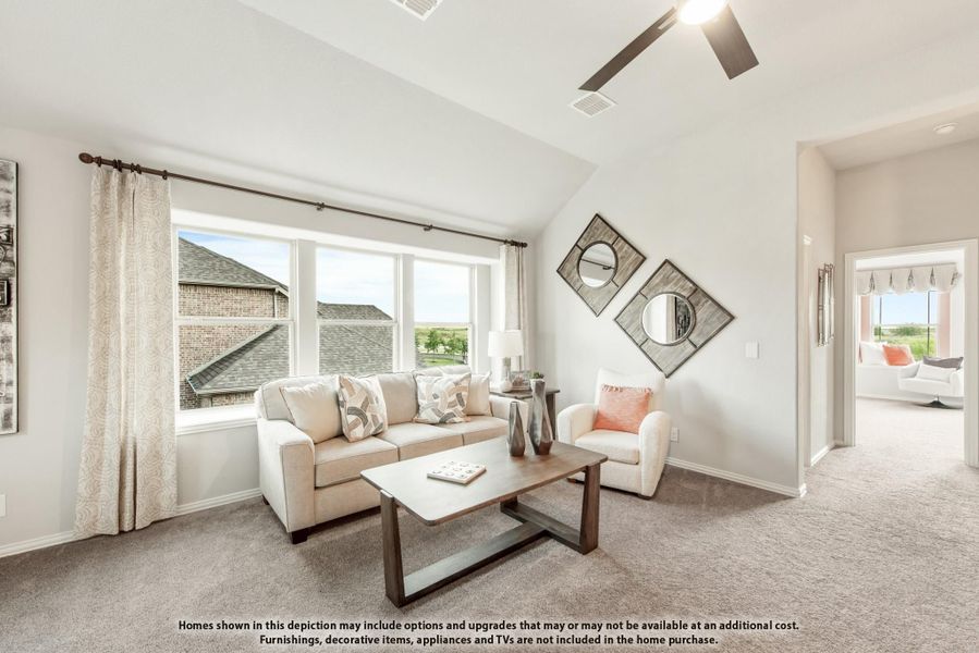 Living room with vaulted ceiling, carpet flooring, large windows, and ceiling fan