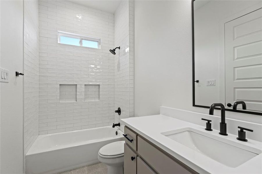 Full bathroom with shower / washtub combination and vanity Full bathroom with shower / washtub combination and vanity