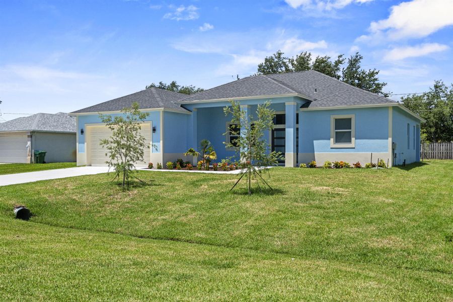 Front exterior of a new home in , Port St. Lucie, FL, highlighting curb appeal (Image 2).