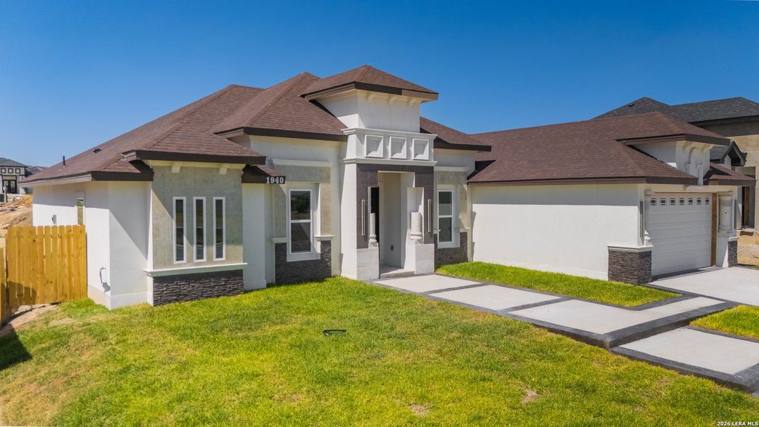 Front exterior of a new home in , Eagle Pass, TX, highlighting curb appeal (Image 1). Front exterior of a new home in , Eagle Pass, TX, highlighting curb appeal (Image 1).