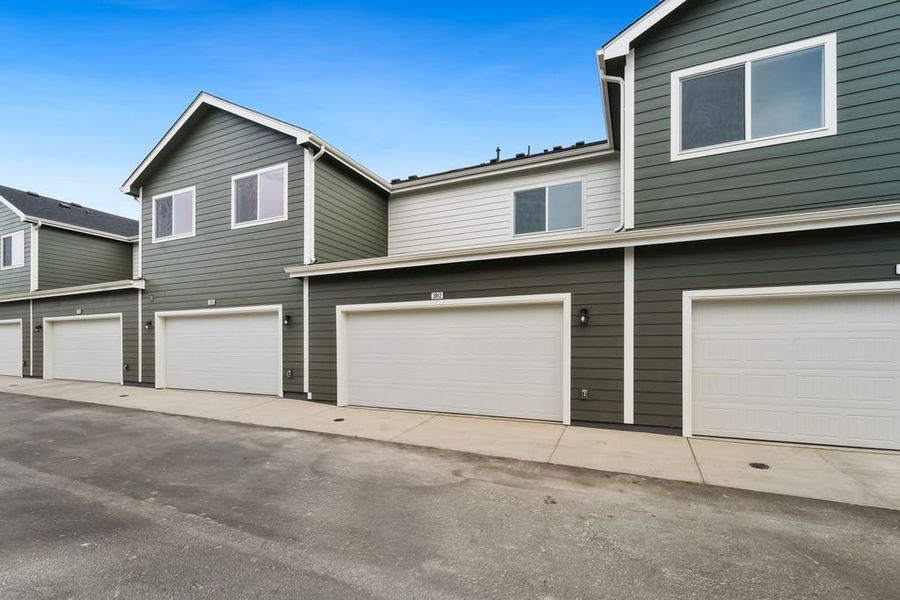 Front exterior of a new home in Liberty Draw, Evans, CO, highlighting curb appeal (Image 19).