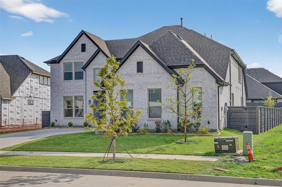 Front exterior of a new home in , Little Elm, TX, highlighting curb appeal (Image 24).