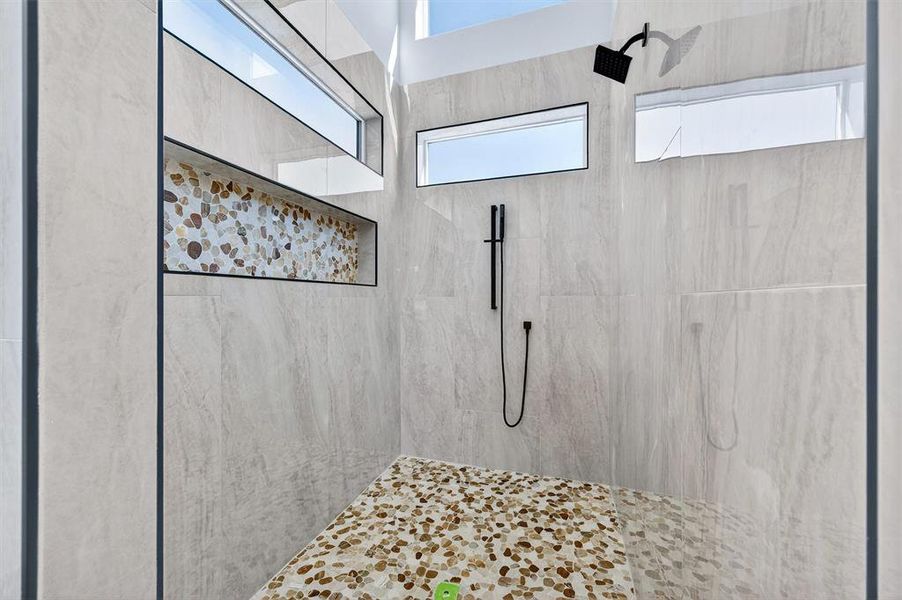 Full bath with tiled shower
