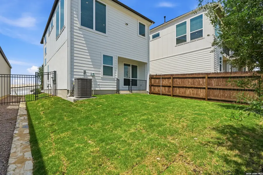 Exterior details and patio area of a home in Prominence Urban, San Antonio (Image 3).
