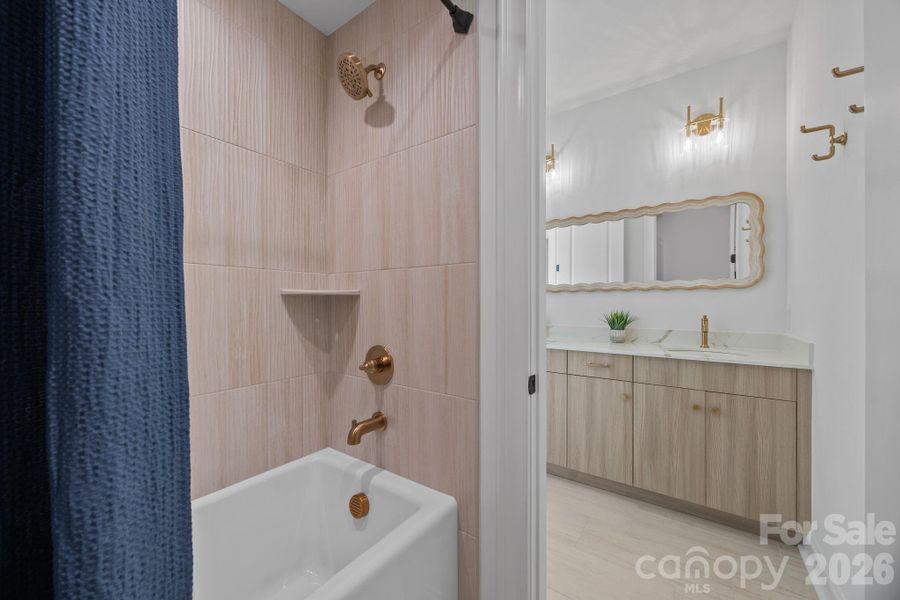 Separate room for the shower/tub and toilet, from the vanities