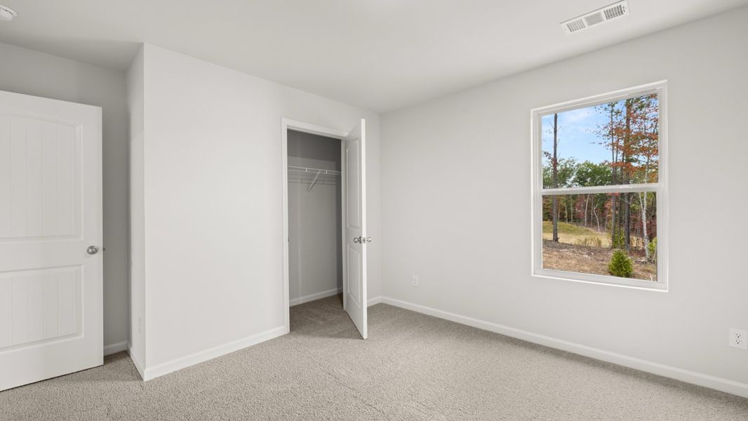 Representative unfurnished interior of a home built from the Hayden by D.R. Horton in Liberty Crossing, Braselton (Image 27).